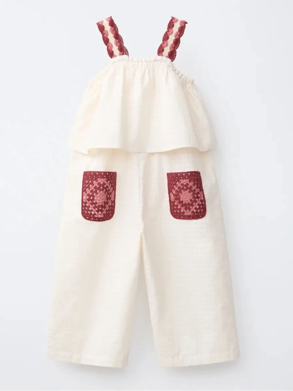100% cotton jumpsuit with crochet pocket and straps